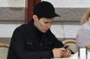 In this photo taken Saturday, May 19, 2012, Pavel Durov, founder of Russia's leading social network site VKontakte, or "in contact", sits in a cafe in Red Square in Moscow, Russia. Creator of Russia's leading social network Durov left his post as CEO on Tuesday April 22, 2014, and is understood to have left Russia, one week after he posted online what he said were documents from the security services demanding personal details from 39 Ukraine-linked groups on VKontakte.(AP Photo/Roman Kulik)