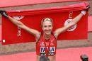British runner Paula Radcliffe celebrates after crossing the finish line in her last ever race during the 2015 London Marathon in central London on April 26, 2015
