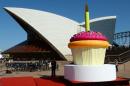 A giant birthday cup cake is displayed on the steps of the Sydney Opera House as the world heritage-listed building celebrates its 40th birthday, on October 20, 2013