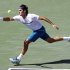 Roger Federer, of Switzerland, returns to Ryan Garrison during the Sony Ericsson Open tennis tournament in Key Biscayne, Fla., Saturday, March 24, 2012. Federer won 6-2, 7-6(3). (AP Photo/Alan Diaz)