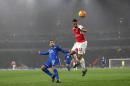 Arsenal's French midfielder Francis Coquelin (R) jumps to win a header as Everton's English midfielder Aaron Lennon (L) looks on during the English Premier League football match in London on October 24, 2015