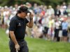 Phil Mickelson tips his hat on the 12th green during the first round of the U.S. Open golf tournament at Merion Golf Club, Thursday, June 13, 2013, in Ardmore, Pa. (AP Photo/Charlie Riedel)
