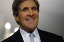 U.S. Secretary of State John Kerry smiles following his meeting with Canada's Foreign Minister John Baird at the State Department in Washington