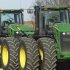 This Jan. 6, 2012 photo, shows John Deere farm tractors at Sloan's Implement John Deere Dealership, in Virden, Ill.  Deere & Co. said Wednesday, Feb. 15, 2012, strong equipment sales, especially outside the United States and Canada, helped its quarterly profit grow 4 percent and prompted an improved outlook for 2012. (AP Photo/Seth Perlman)
