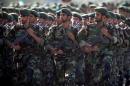 Members of Iran's Revolutionary Guards march during a military parade to commemorate the 1980-88 Iran-Iraq war in Tehran