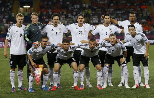 Standing left to right are Germany's Holger Badstuber, goalkeeper Manuel Neuer, Mats Hummels, Mario Gomez, Sami Khedira, Jerome Boateng, and bottom left to right are Philipp Lahm, Thomas Mueller, Lukas Podolski, Bastian Schweinsteiger and Mesut Oezil before the start of the Euro 2012 soccer championship Group B match between the Netherlands and Germany in Kharkiv, Ukraine, Wednesday, June 13, 2012. (AP Photo/Frank Augstein)