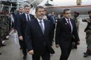 Egypt's President Mohamed Mursi arrives at King Shaka Airport in the coastal city of Durban during his visit to South Africa for the 5th BRICS Summit