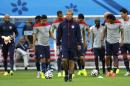 United States' Jurgen Klinsmann, center, walks on the pitch with his team during a training session at the Arena da Amazonia in Manaus, Brazil, Sunday, June 22, 2014. The U.S. will play Portugal in group G of the 2014 soccer World Cup on June 22. (AP Photo/Paulo Duarte)