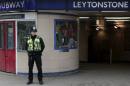 A police officer patrols outside Leytonstone Underground station in east London