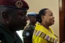 Central African Republic transitional President Catherine Samba Panza (R) arrives at a hotel in Bangui on December 9, 2015, as presidential candidates gather to sign a code of conduct agreed for elections to be held on December 27