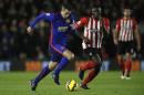 Manchester United's Dutch striker Robin van Persie (L) runs with the ball during the English Premier League football match between Southampton and Manchester United on December 8, 2014