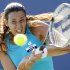 Bartoli of France returns a shot during her match against Mallory Burdette of the U.S. at the Bank of the West Classic women's tennis tournament on the Stanford University campus in Palo Alto