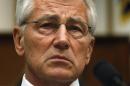 U.S. Defense Secretary Hagel listens to opening statements before testifying about the Bergdahl prisoner exchange on Capitol Hill in Washington