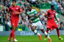 Celtic striker Moussa Dembele (C) became the first player to score a hat-trick in an Old Firm league match in 50 years