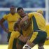 Beale of Australia's Wallabies with ball in hand is tackled by Pocock and Sharpe during training ahead of their Tri-Nations rugby union match against South Africa in Durban