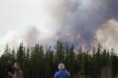 Smoke rises from the wildfire off Highway 63 on May 7, 2016 outside Fort McMurray in Alberta, Canada
