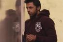 Businessman Shrien Dewani is led into a prison van at Westminster Magistrates Court in central London