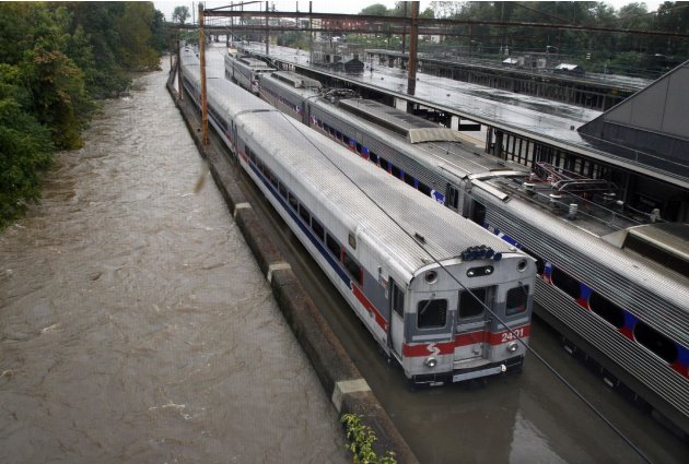 Two Southeastern Pennsylvania Transportation Authority trains sit in water on flooded tracks at Trenton train station Sunday, Aug. 28, 2011, in Trenton, N.J., as rains from Hurricane Irene are causing