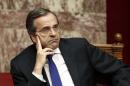 Greece's Prime Minister Samaras attends a parliament session before a confidence vote for the country's coalition government in Athens