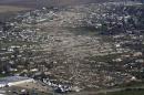 An aerial view shows the path of destruction caused by a tornado that touched down in Washington, Illinois,