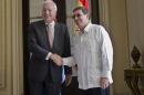 Cuba's Foreign Minister Bruno Rodriguez, right, and Spanish Foreign Minister Jose Manuel Garcia-Margallo pose for a photo prior to their meeting at the Foreign Ministry in Havana, Cuba, Tuesday, Nov. 25, 2014. Margallo is in Cuba on a three-day visit. (AP Photo/Ramon Espinosa)