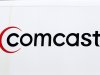 In this photo taken Feb. 15, 2011, a Comcast logo is displayed on a Comcast utility truck in Pittsburgh. Comcast, the country's largest cable TV company, is bucking the trend among cable companies by making more money from its TV subscribers  Wednesday, Aug. 3, 2011. (AP Photo/Gene J. Puskar)