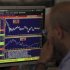 Trader looks at his screen on Unicredit Bank trading floor in downtown Milan