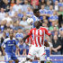 Stoke's Kenwyne Jones, bottom, fights for the ball against Chelsea's John Obi Mikel during their English Premier League soccer match at the Britannia Stadium, Stoke, England, Sunday Aug. 14, 2011. (AP Photo/Jon Super)   NO INTERNET/MOBILE USAGE WITHOUT FOOTBALL ASSOCIATION PREMIER LEAGUE(FAPL)LICENCE. EMAIL info@football-dataco.com FOR DETAILS.