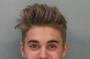 This police booking mug made available by the Miami Dade County Corrections Department shows pop star Justin Bieber, Thursday, Jan. 23, 2014. Bieber and singer Khalil were arrested for allegedly drag-racing on a Miami Beach Street. Police say Bieber has been charged with resisting arrest without violence in addition to drag racing and DUI. Police also say the singer told authorities he had consumed alcohol, smoked marijuana and taken prescription drugs. (AP Photo/Miami Dade County Jail)