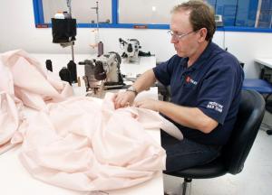 An employee sews an airbag at Takata&#39;s crash-testing&nbsp;&hellip;