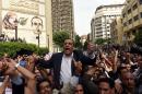 The head of the Egyptian journalists union, Yahiya Kallash demonstrates with journalists outside the Journalist Syndicate headquarters in Cairo on May 4, 2016