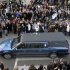 People pay their respects as the hearse carrying the casket of former Penn State football coach Joe Paterno passes through State College, Pa., Wednesday Jan. 25, 2012. Paterno died Sunday at the age of 85. (AP Photo/John Beale)