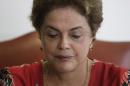 Brazil's President Dilma Rousseff attends a meeting with Brazilian Ambassador Roberto Azevedo, director general of the World Trade Organization, at the Planalto Presidential Palace, in Brasilia, Tuesday, March 29, 2016. Former Brazilian President Luiz Inacio Lula da Silva said Monday that he believes Rousseff, his embattled successor and protege, can survive mounting pressure in Congress for her impeachment. Rousseff recently appointed Silva as her chief of staff in a much-discussed move that still must be confirmed by Brazil's top court. (AP Photo/Eraldo Peres)