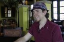 In this image taken from video shot July 18, 2012, Seth Collins talks about leaving a $500 tip for 21-year-old waitress Chelsea Powell at Bella Notte restaurant in Lexington, Ky. Seth's brother, Aaron Collins, who died on July 7, left instructions in his will to leave a $500 tip for a server. Since Collins' July 7 video of him telling his brother's story and handing Powell the cash went viral, donors inspired by Aaron's dying act of charity have contributed $47,000. (AP Photo)