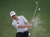 Louis Oosthuizen of South Africa hits from a sand trap on the second hole during second round play in the 2013 Masters golf tournament in Augusta