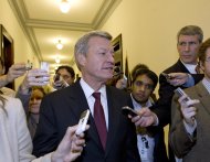 Supercommittee member, Senate Finance Committee Chairman Sen. Max Baucus, D-Mont., walks with reporters as he departs the Capitol Hill office of Sen. John Kerry, D-Mass., after meeting with other Supercommittee members as time for action by the deficit reduction panel grows short, Monday, Nov. 21, 2011, on Capitol Hill in Washington. (AP Photo/J. Scott Applewhite)