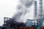 Black smoke rises from reactor number three at the Fukushima nuclear power plant at Okuma town. Smoke and steam again rose from damaged reactors on Tuesday at Japan's quake-hit Fukushima nuclear power plant, where workers have battled to avert a large-scale disaster, Kyodo News reported