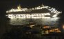 The luxury cruise ship Costa Concordia leans after it ran aground off the coast of the Isola del Giglio island, Italy, gashing open the hull and forcing some 4,200 people aboard to evacuate aboard lifeboats to the nearby Isola del Giglio island, early Saturday, Jan. 14, 2012. About 1,000 Italian passengers were onboard, as well as more than 500 Germans, about 160 French and about 1,000 crew members. (AP Photo/Giglionews.it, Giorgio Fanciulli)