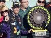 Denny Hamlin stands next to the trophy after winning the NASCAR Sprint Cup Series auto race at Phoenix International Raceway on Sunday, March 4, 2012, in Avondale, Ariz. (AP Photo/Paul Connors)