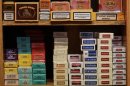 Packs of cigarettes are seen on a shelf at a tobacco store in central Madrid