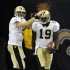 New Orleans Saints quarterback Drew Brees (9) congratulates wide receiver Devery Henderson (19) after Henderson scored on a 79-yard touchdown pass from Brees during the second quarter of an NFL football game against the Chicago Bears at the Louisiana Superdome in New Orleans, Sunday, Sept. 18, 2011. (AP Photo/Bill Feig)