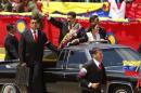 Venezuela's President Maduro arrives at a military parade to commemorate the first anniversary of the death of Venezuela's late president Chavez in Caracas
