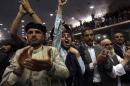 Supporters of Afghan presidential candidate Abdullah Abdullah shout slogans during a gathering in Kabul