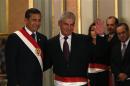 Peru's President Humala greets new Prime Minister Villanueva during the swearing-in ceremony of new members of his cabinet at the government palace in Lima