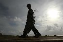 Army soldiers patrol along Galle face green in Colombo