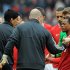 Manchester United's Patrice Evra (R) and Liverpool's Luis Suarez (L) fail to shake hands before their match on Saturday