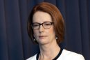 Australian Prime Minister Gillard leaves a media conference at Parliament House in Canberra