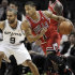 Chicago Bulls' Derrick Rose, right, drives around San Antonio Spurs' Tony Parker, of France, during the first half of an NBA basketball game on Wednesday, Feb. 29, 2012, in San Antonio. (AP Photo/Darren Abate)