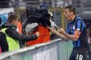 Atalanta's German Denis, right, of Argentina, celebrates his second goal with his son Matias during a Serie A soccer match against Napoli in Bergamo, Italy, Sunday, Feb. 2, 2014. (AP Photo/Felice Calabro')