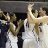 Connecticut center Stefanie Dolson (31) celebrates a win over Penn State with her teammates following an NCAA women's tournament regional semifinal college basketball game in Kingston, R.I., Sunday, March 25, 2012. Connecticut won 77-59. (AP Photo/Stew Milne)